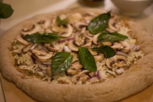 Pizza with mushrooms and basil