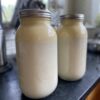 Milk with cream on top on the kitchen counter